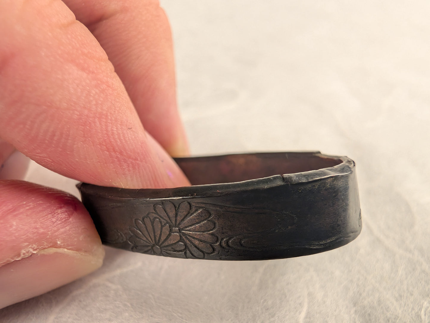 Shakudo Foiled Fuchi with Chrysanthemum and Wave Motif - FU-019