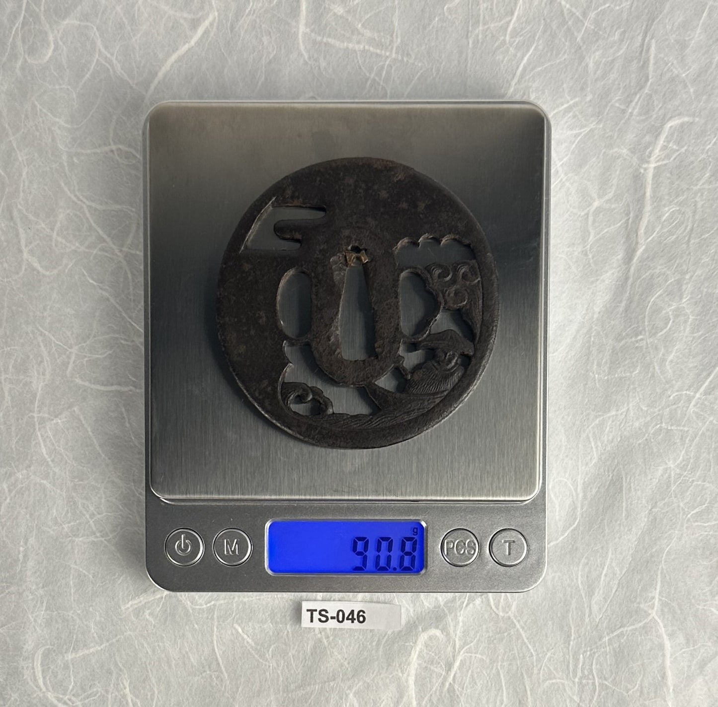 Iron Sukashi Tsuba Depicting Boatman Battered By Waves – TS-046