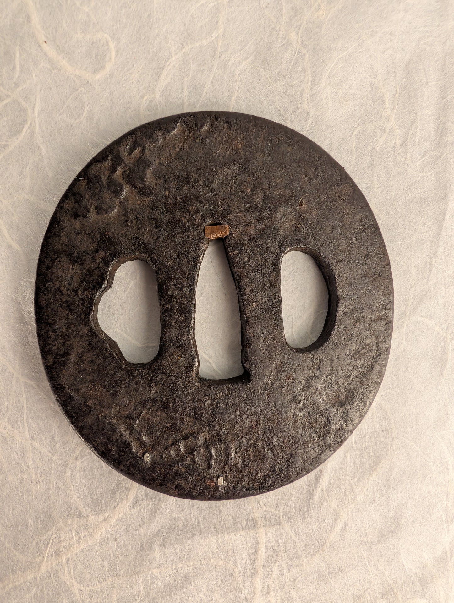 Iron Tsuba with Seated Archer Motif – TS-060