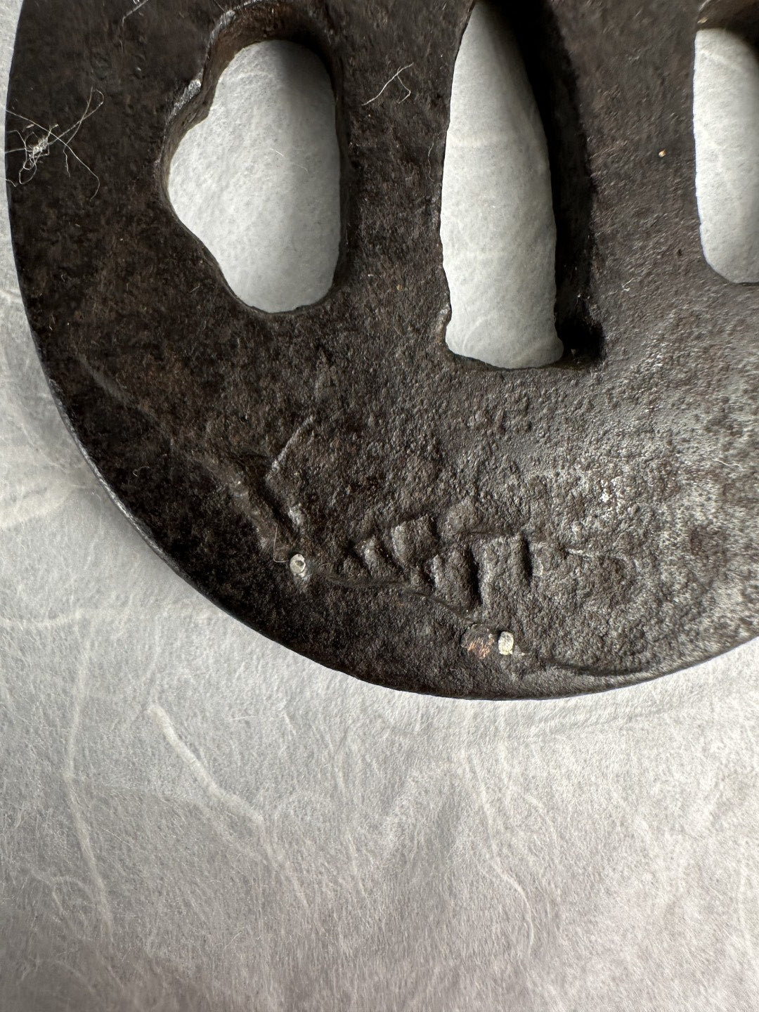 Iron Tsuba with Seated Archer Motif – TS-060