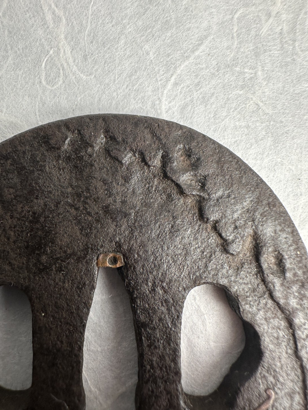 Iron Tsuba with Seated Archer Motif – TS-060