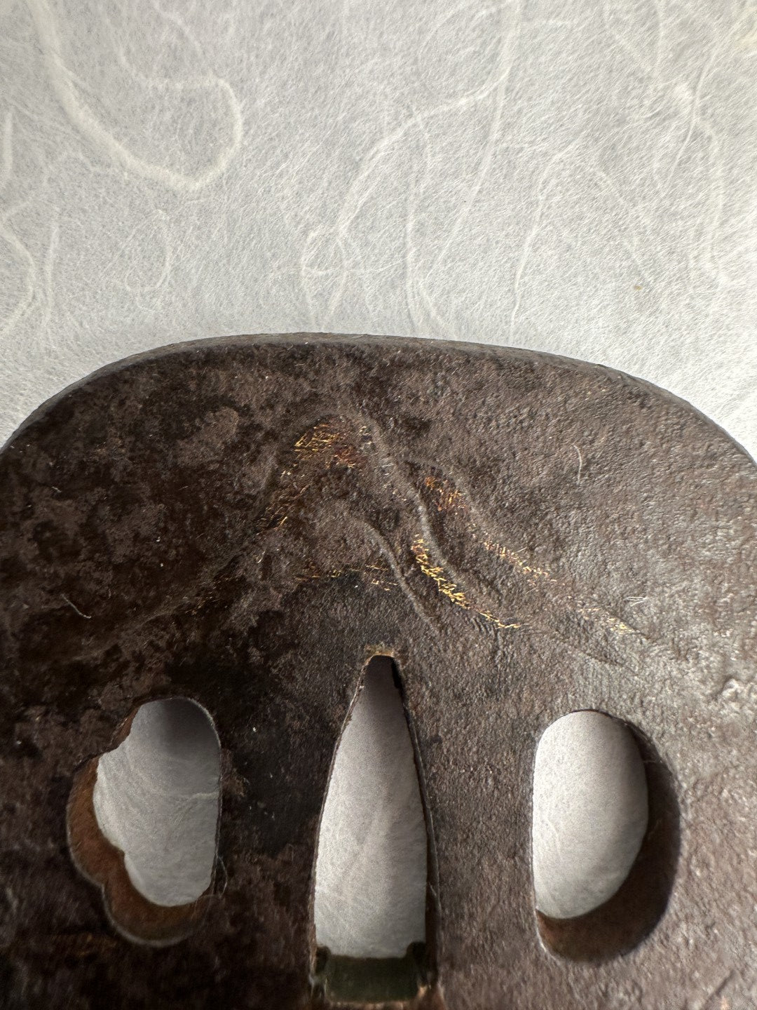 Iron Kaku-maru Tsuba with Inlaid Praying Figures in Nunome-gold Mountains– TS-073