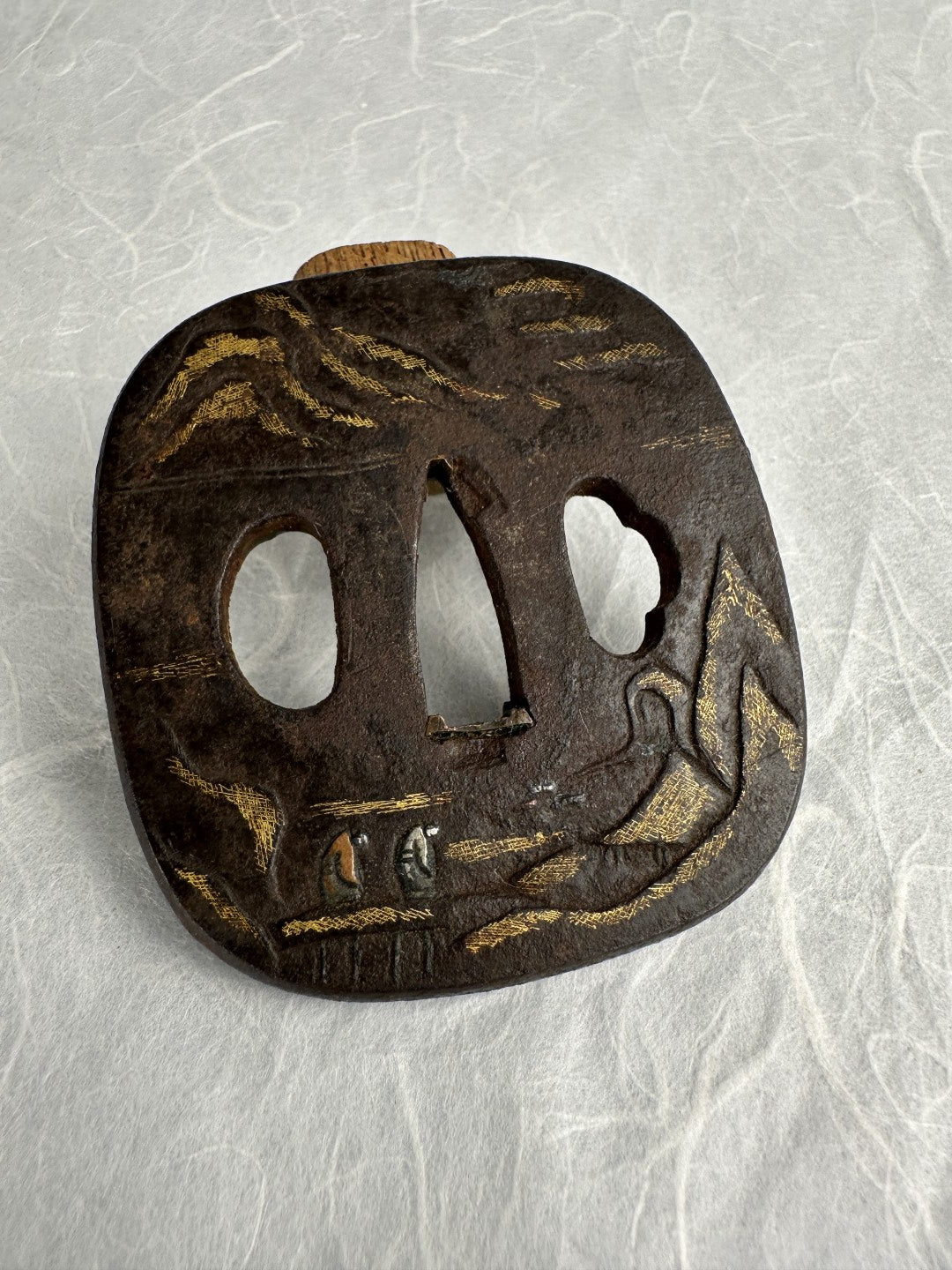 Iron Kaku-maru Tsuba with Inlaid Praying Figures in Nunome-gold Mountains– TS-073