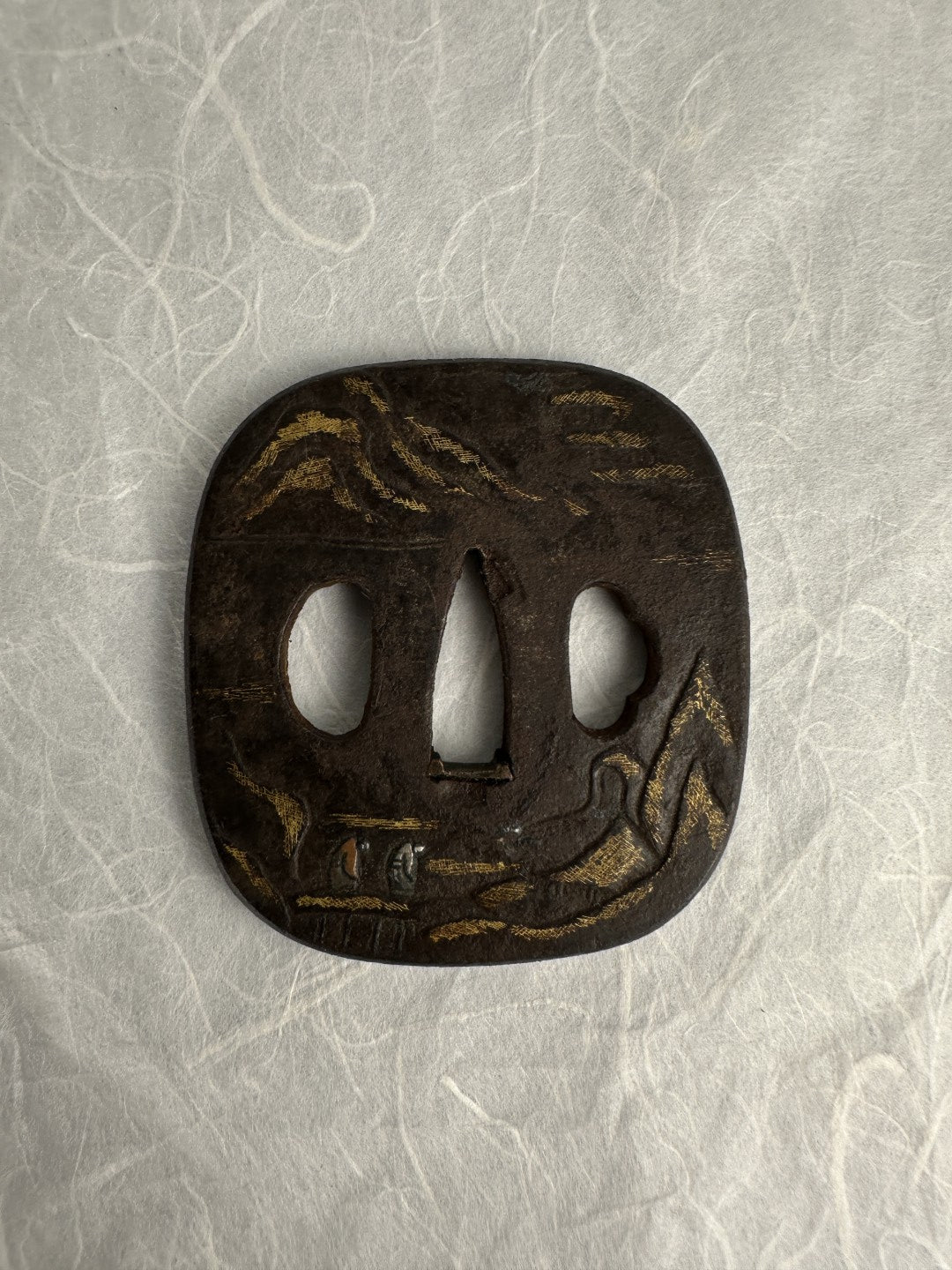 Iron Kaku-maru Tsuba with Inlaid Praying Figures in Nunome-gold Mountains– TS-073