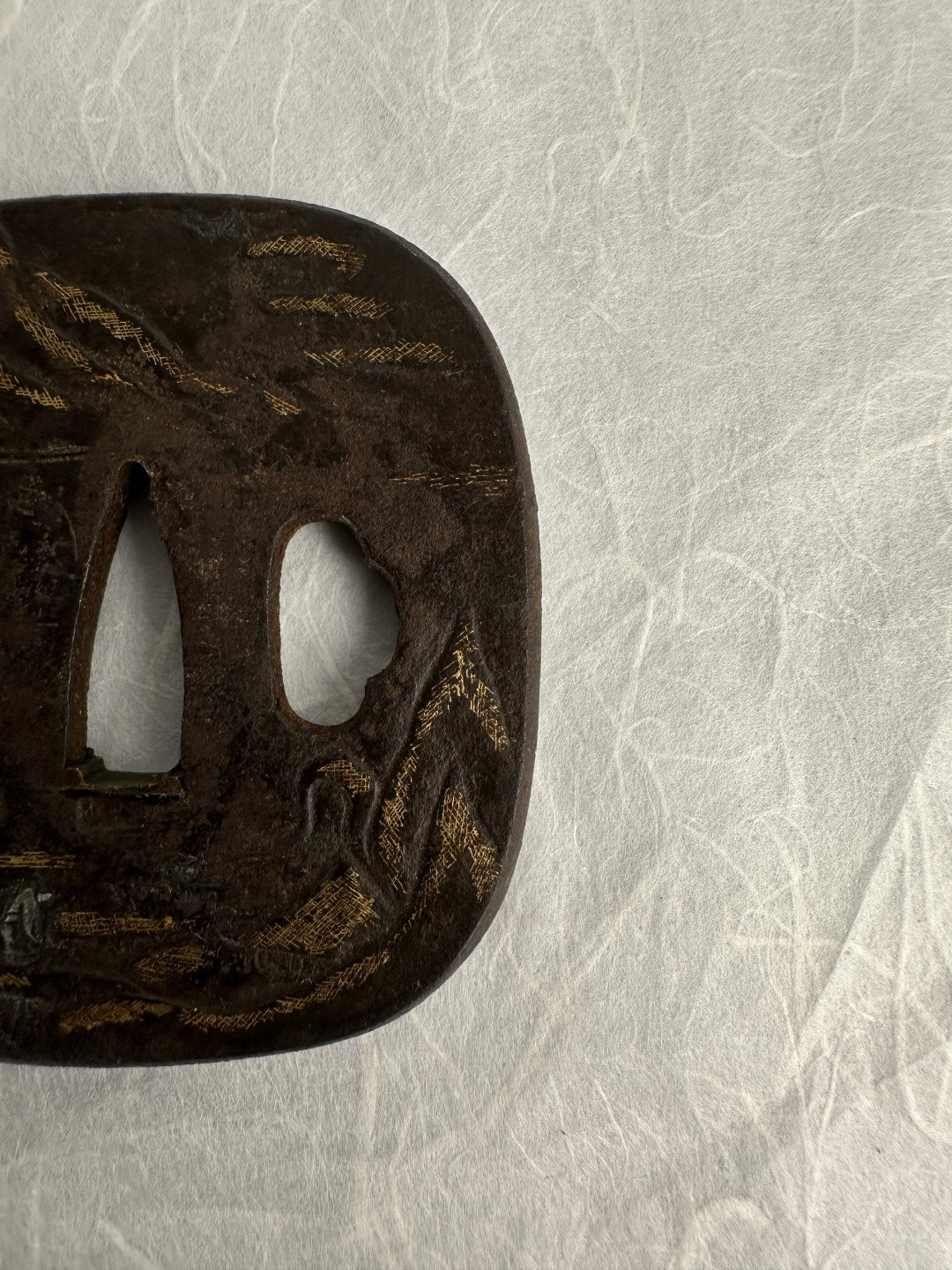 Iron Kaku-maru Tsuba with Inlaid Praying Figures in Nunome-gold Mountains– TS-073