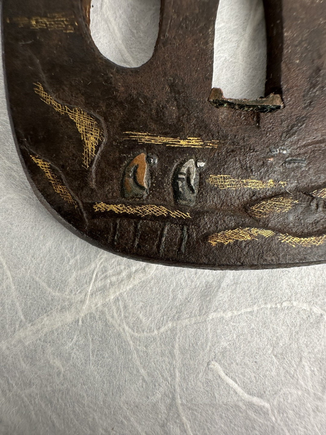 Iron Kaku-maru Tsuba with Inlaid Praying Figures in Nunome-gold Mountains– TS-073