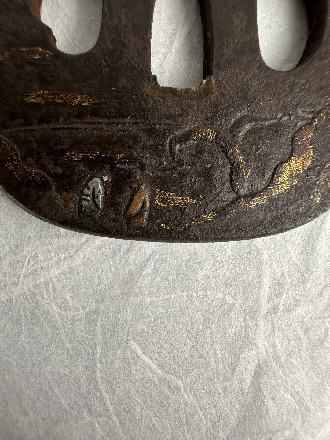 Iron Kaku-maru Tsuba with Inlaid Praying Figures in Nunome-gold Mountains– TS-073